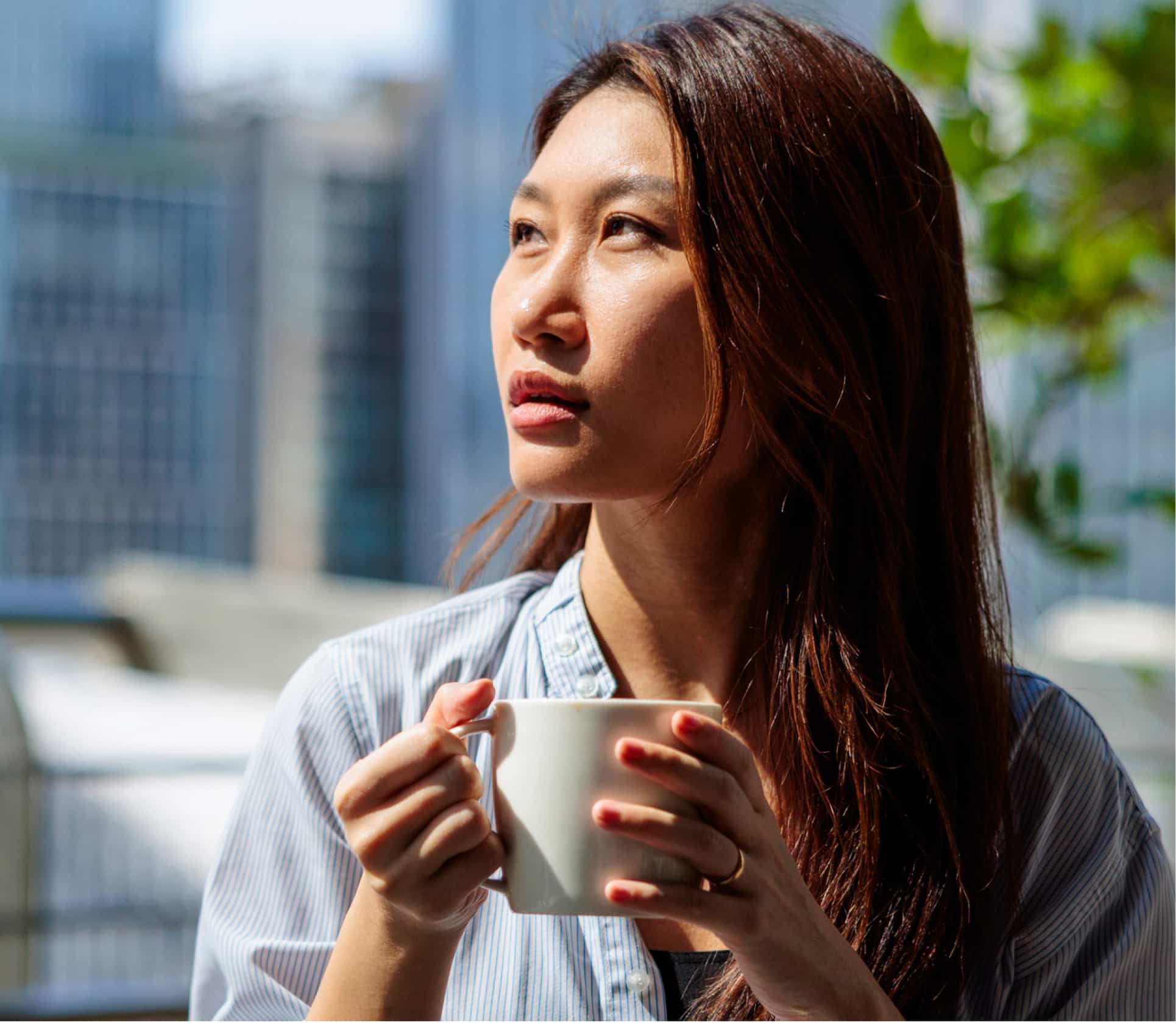 To New Heights - woman on terrace with coffee